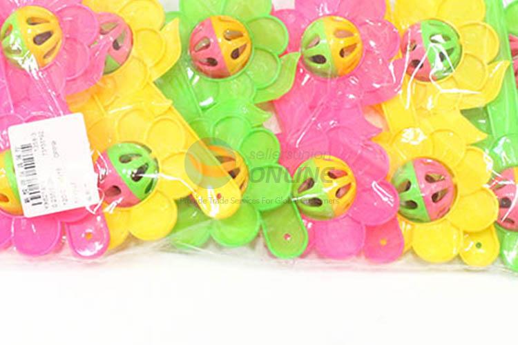 Wholesale cheap flower shape hand bell rattle toy for baby