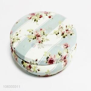 Hot sale round flat iron cans with flower printing