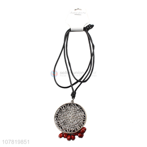 China manufacturer vintage round hollow pendant necklace with red beads