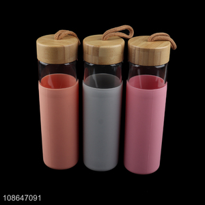 Hot selling 550ml glass water bottle with bamboo lid & bottle sleeve