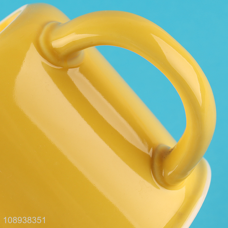 Low price yellow ceramic water cup water mug with handle